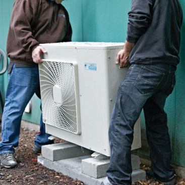 The outdoor unit is put in position on the risers.