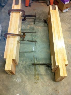 The 2x10 fir laminations glued up to replace rotted post sections were offset to create a slot for joining to the sound sections of the original posts.