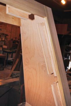 Plywood cleats on top of 3/4-inch spacers provided a recessed fastening surface for the front panel.