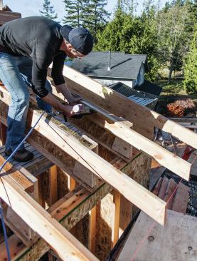 For open soffits, however, we cut the rafters plumb with the plate line and add 2x6 tails flush with the top flange of each I-joist rafter.