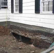 To prevent damage to the foundation, half the wall at a time was excavated and temporarily shored up.