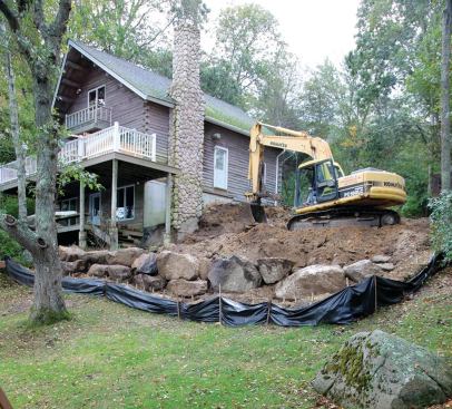 The steep slope presented a challenge at every stage of construction, starting with the excavation and the removal of several large boulders