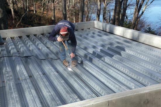 The pans are also welded to the I-beams.