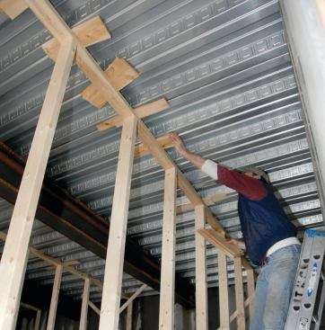 Temporary support was provided beneath the pans in preparation for pouring the concrete garage floor.