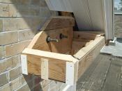 Solid blocks bolted into place provided attachment for the built-out boxes, which we beveled to match the 8/12 pitch.