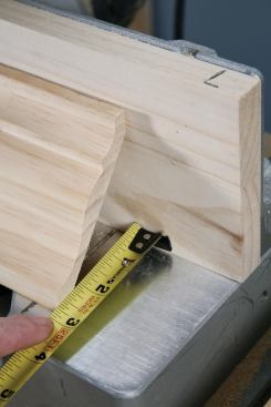 With the crown upside-down, the author measures its horizontal projection.