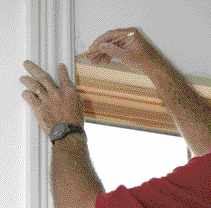 He then sets the side casings in place on the window stool and transfers the mark to the casing.