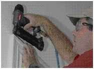 He joins the miter together with glue, and cross-pins the joints.