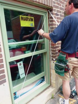 Check the side jambs for level and tack the adjacent corner. After taking diagonal measurements to check the window for square, nail off the rest of the flange every 6 to 8 inches.