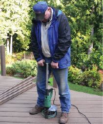 Figure 4. Nearly as fast as nailing is face-screwing with a collated-screw gun. Screws can be had with heads in a variety of colors to match most composite decking brands.