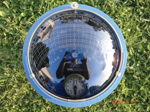 The author uses the Solar Pathfinder site-assessment tool to evaluate the effect of local shading on a PV array. For optimum power output, the angle of a fixed photovoltaic array should equal the local latitude — about 42 degrees at this Massachusetts site.