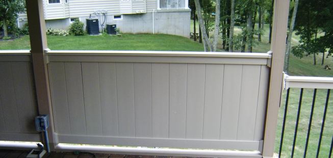 A rail-height solid wall offers the homeowners some privacy while still allowing them to enjoy the view.