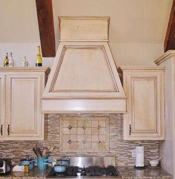 A plywood box covered the gap between the hood and the sloping ceiling; the joints were trimmed with panel molding.
