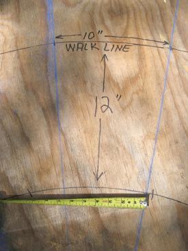 Then, he swings the walk line a foot inside the inner arc. Tread locations are marked at 10-inch-minimum intervals.