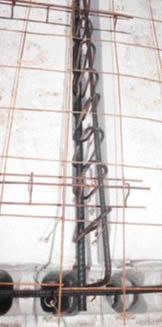 The right-angle connecting rods were tied to the #8 longitudinal rod with #2 rebar stirrups, placed 5 inches on-center over a 3-foot run.