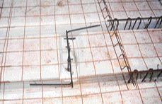 The bolts are set in a cavity scooped out of the deck form and tied to rebar extending back to two adjacent joists.