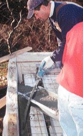 The pressure generated by vibrating and compacting the concrete began to force pieces of retrofitted foam blocking out of place, despite the use of foam adhesive.