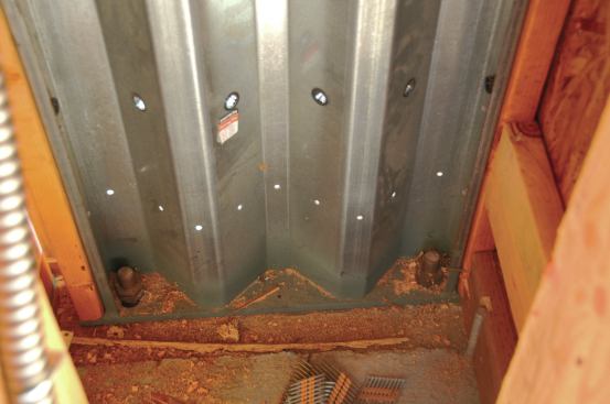 The Simpson steel Strong-Wall for example, has heavy bolts tying it to the foundation at its base, where the overturning and uplift forces could be extreme.
