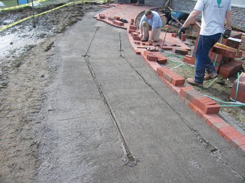 Most projects begin with marking the edges and laying a soldier course of bricks or pavers. Once the edges are set, laying field courses goes quickly.