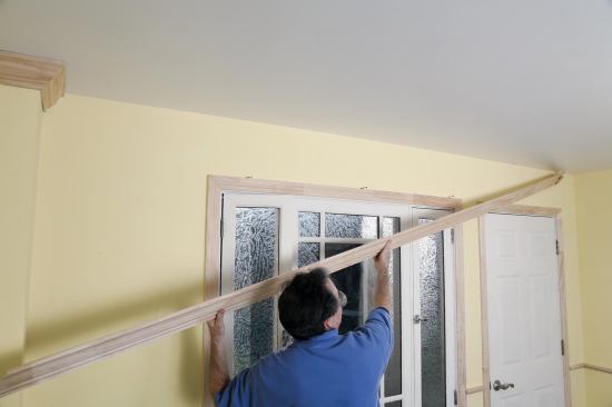 When working without a helper, the author uses a crown hook.