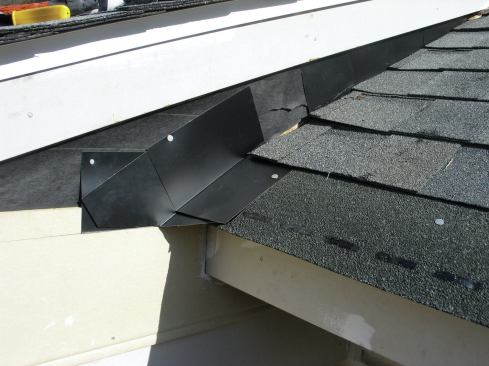 I installed my first full piece of step flashing so that it extended down to the bottom of the starter course.