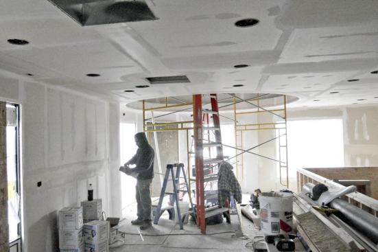 The restored interior was finished with drywall on steel studs. The circular opening that extends upward toward the bottle’s neck is visible at rear.