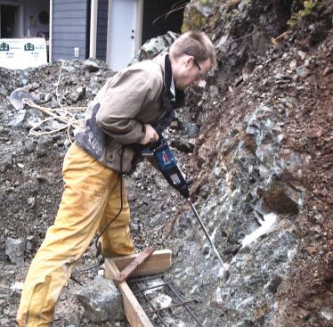 The D-handle tool has a long reach for easier downward drilling.