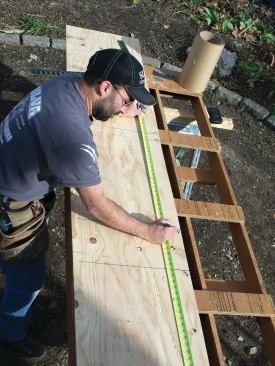 Transferring the required dimensions of the flashing pieces to a plywood story board makes it easier to cut them accurately to length.