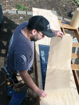 Fold each piece of flashing material twice lengthwise so it's short enough to cut using a standard framing square for a straightedge.