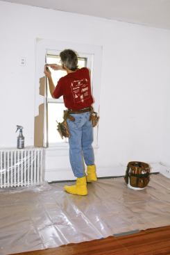 Since old windows of this type typically have some lead paint on them, I set up a lead-safe work space around each of the window frames, and take appropriate safety measures while preparing the sash and stops for weatherstripping.

