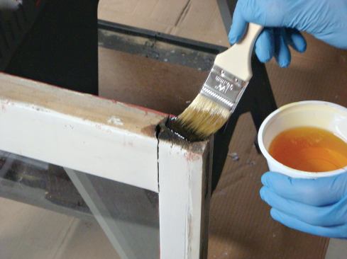 After the cut, the end grain gets a treatment of epoxy consolidant to prevent rot infestation.