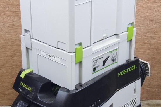 Older Systainers and current Tanos boxes use clip-like latches to hold lids closed and gang boxes together.