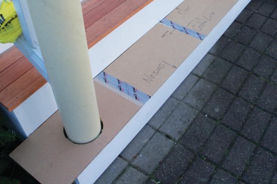 Using a cardboard template helped to fit the bottom tread boards neatly around the newels.