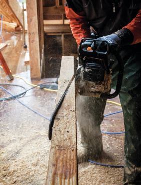 The jacks on the 8/12 side landed on the valley at an 8-degree angle. The only way we could cut this was to freehand with a chain saw.