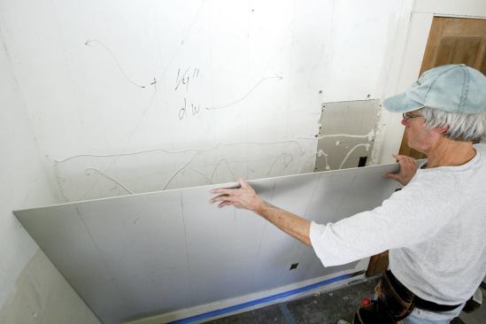 When covering plaster walls, use 1/4-inch drywall to minimize the effect on trim profiles.