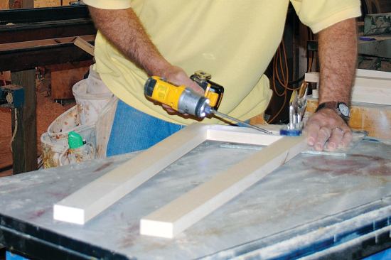 The tapered center section of the newel is made up of four frame-and-panel assemblies. I transferred the dimensions and angles for the stiles and rails from my full-scale drawing, cut them to width and length from 3/4-inch poplar, and joined them together with pocket screws and glue.