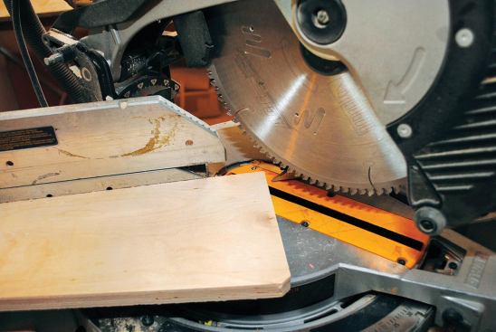 Instead of squaring the corners of my rabbet in the back of the frame with a chisel, I clipped the corners of each plywood panel with the miter saw.