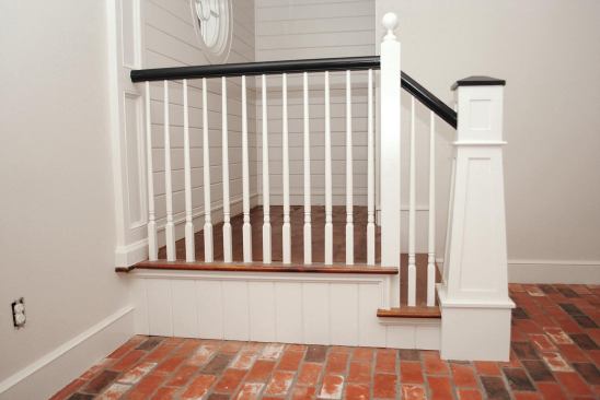 Later, after I was finished installing the treads, handrail, and balusters for the landing, my painter added the finishing touches.