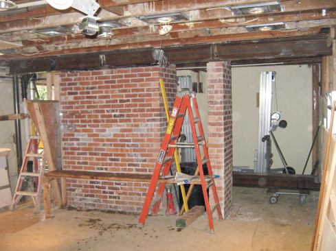 We hoisted the first beam with our Genie lifts and positioned it.