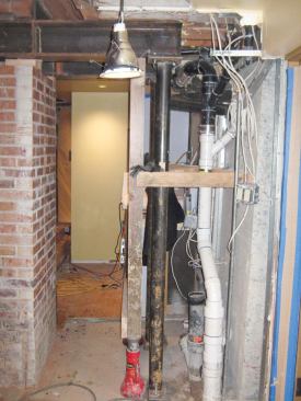 We bolted the beam to the post caps at each end while our temporary supports were still in place.