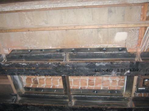 With the brick out of the way, we added a couple of angles from underneath and grouted any remaining voids between the steel and brick.