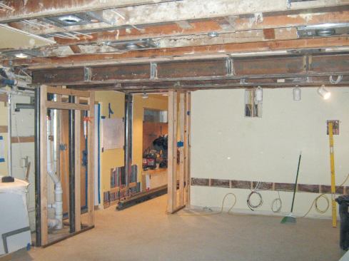 The area where the chimney base had been was now open for construction.