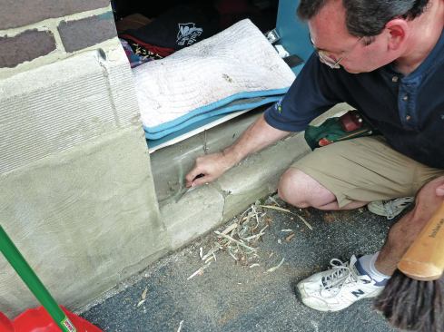 Clean all remaining paint and caulk from the opening with an oscillating tool or scraping by hand.