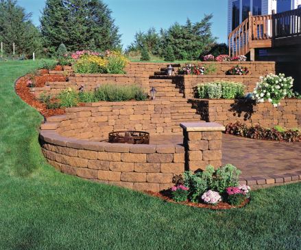 Blending segmental retaining walls and hardscape with a deck expands design options.