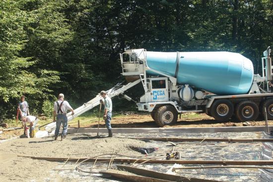 Ready-mixed concrete at $85 per yard plus a short-load charge of $120 will run at least $205. It’s not cost-effective for pours smaller than one yard, but it makes sense for larger pours.