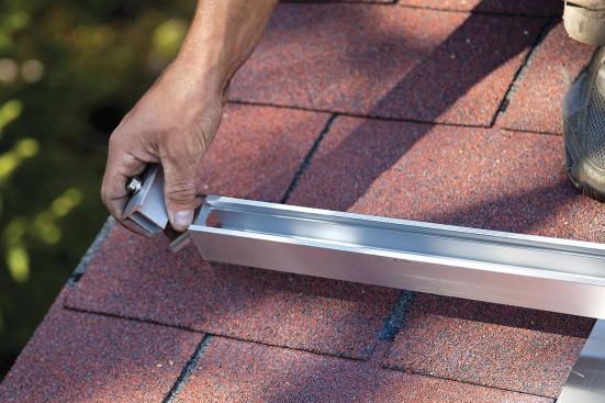 Intermodule clips are slipped into tracks as each rail is installed.