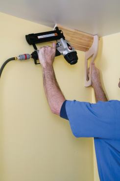 The author works around the room from left to right, with copes on the left ends and butt cuts on the right. The process starts with a temporary starter piece carefully positioned and tacked into place in the corner of the last wall.