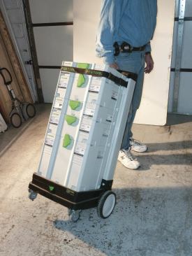 The SysRoll hand truck is a four-wheel carrier with an upright back that doubles as a handle.
