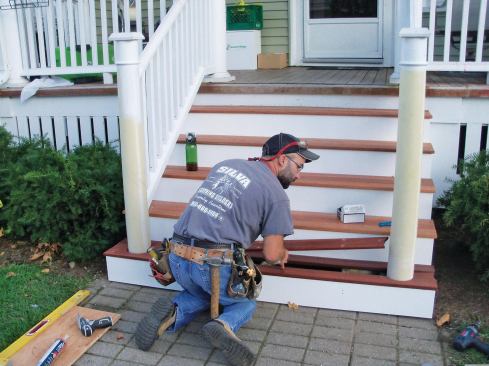 The author carefully eyed the bottom tread boards during installation to ensure an even gap.