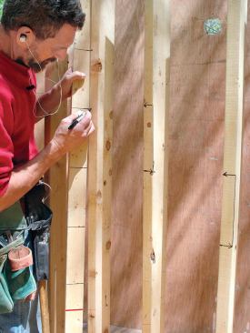 Using a story pole, the author marks the tread elevations on the bending frame.